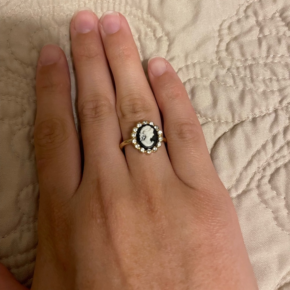 Cameo ring with decorative rhinestones all around